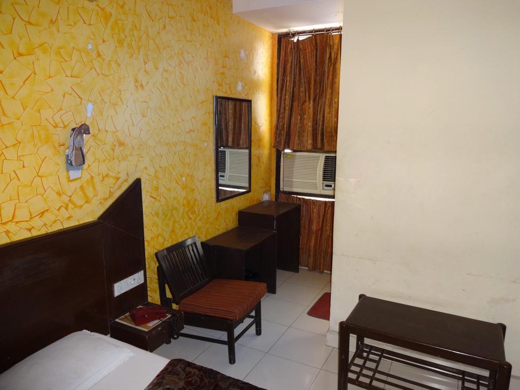 Hotel Elegant International New Delhi Rum bild